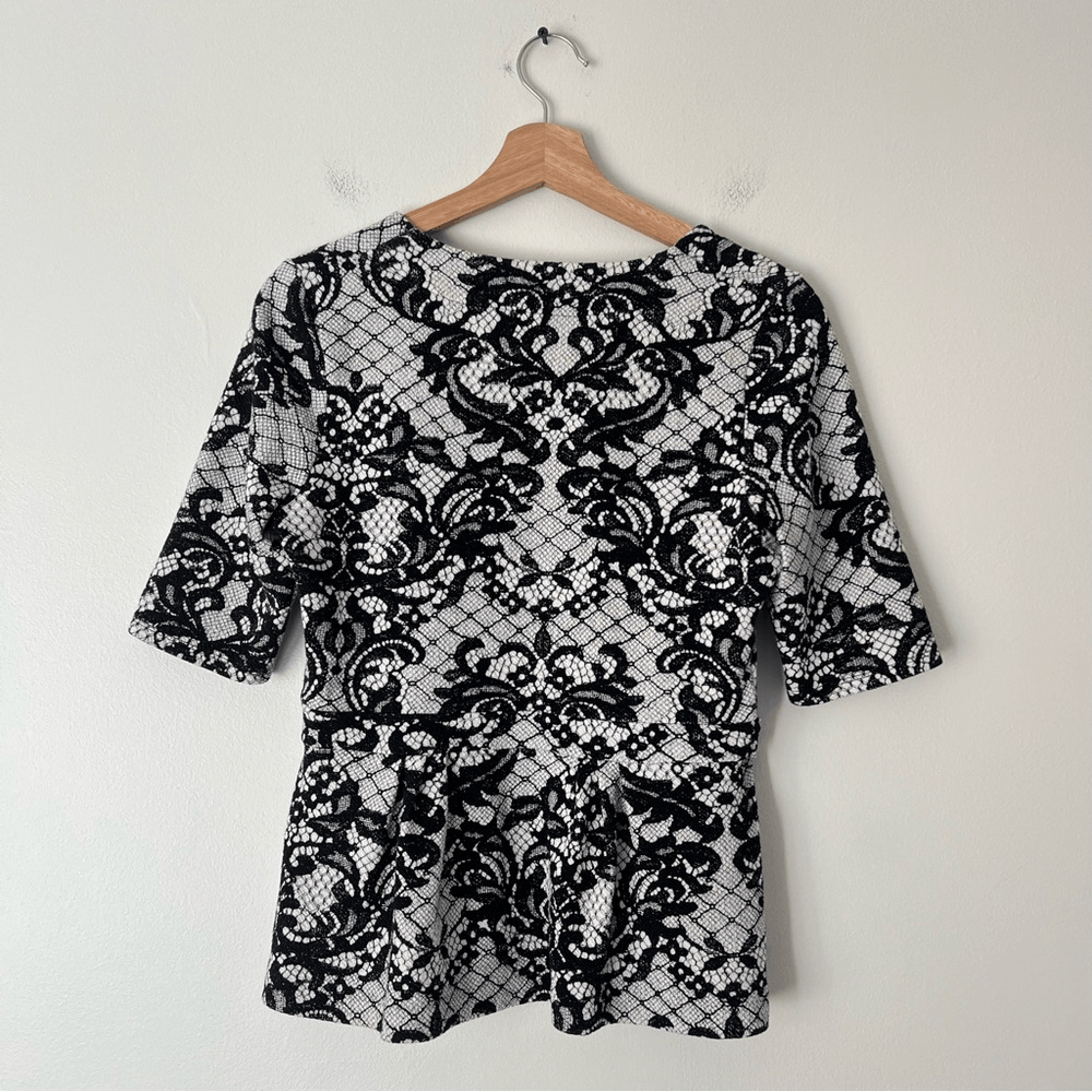 Anthropologie Postmark Leia Peplum Lace Print Top